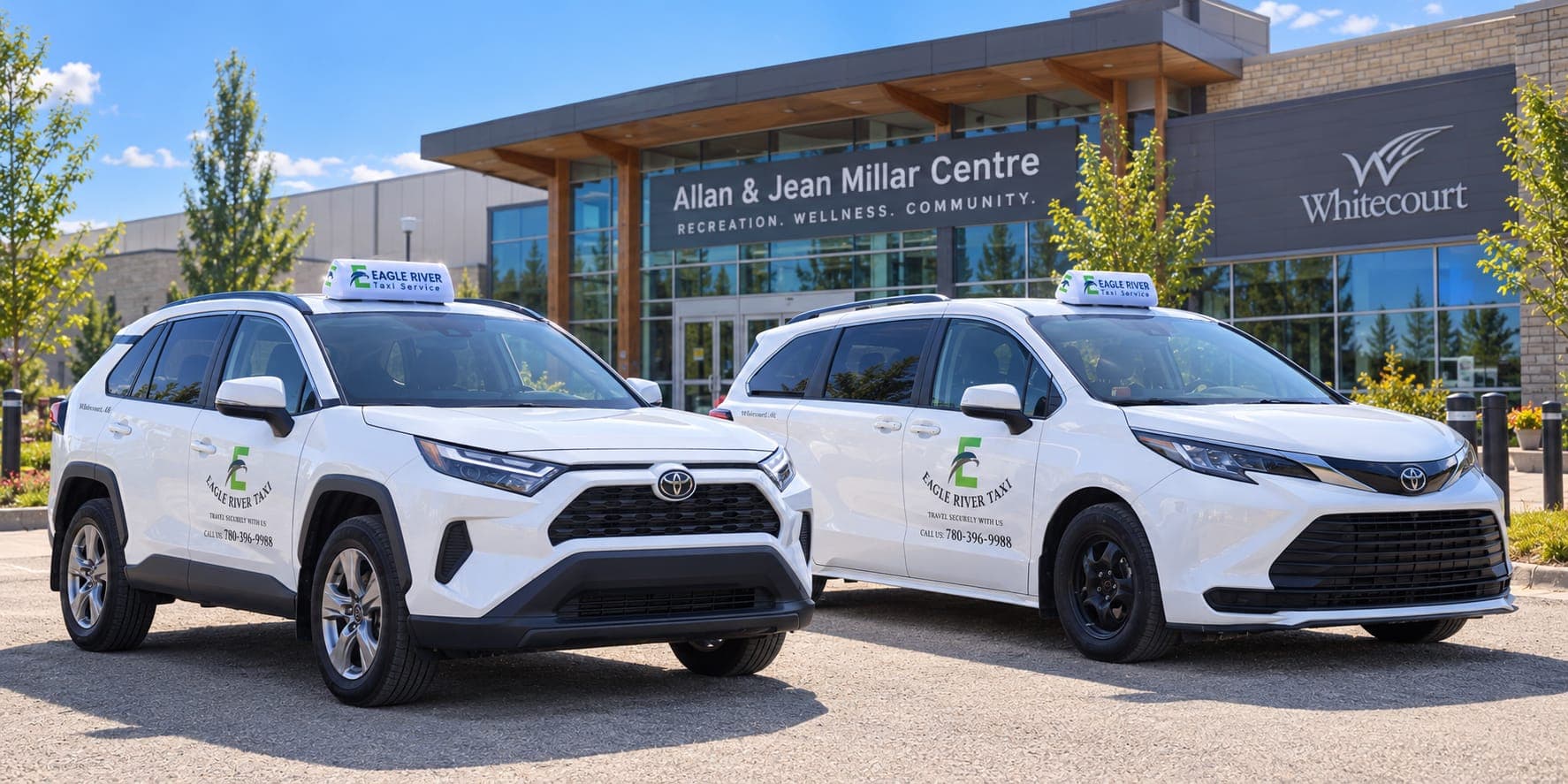 Two branded Eagle River Cabs vehicles outside the Allan and Jean Millar Centre.