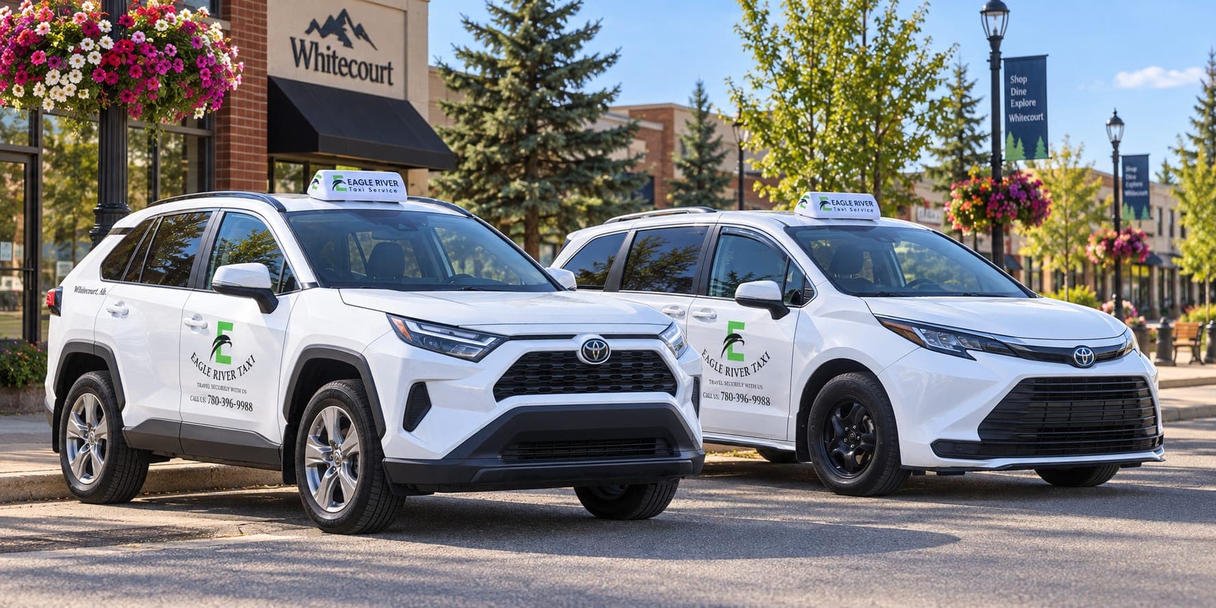 Branded Eagle River Cabs vehicles beside flowers in Whitecourt.